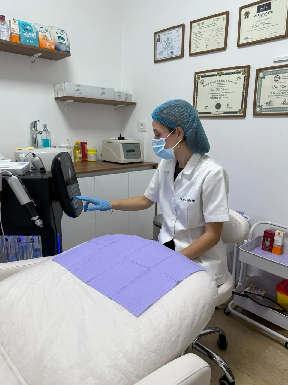 Rita preparing HydraFacial equipment at her clinic in Baabda