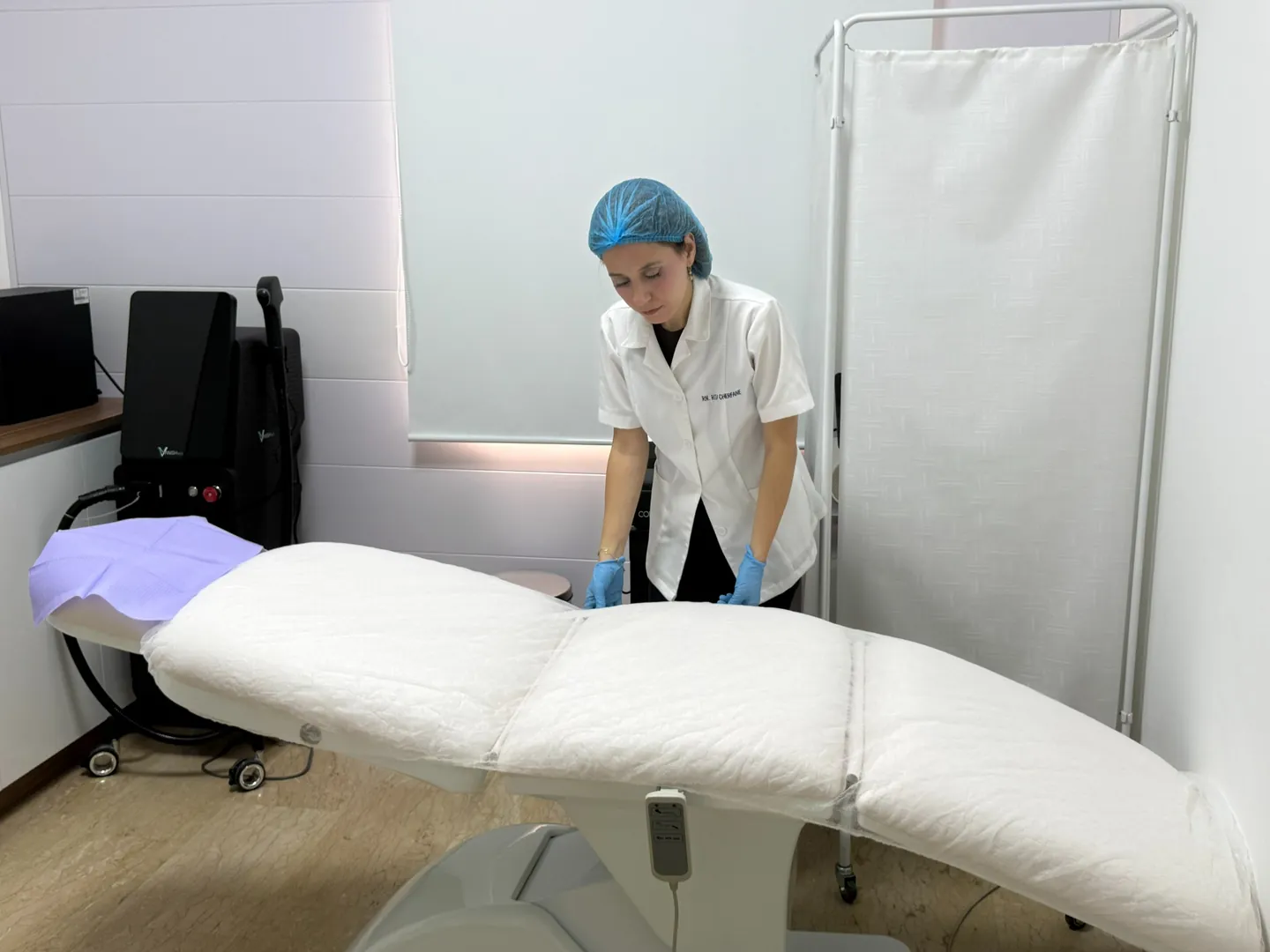 Rita preparing the laser treatment room before an appointment