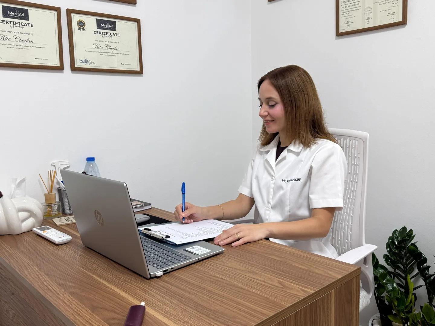 Rita reviewing notes during a personal skin consultation